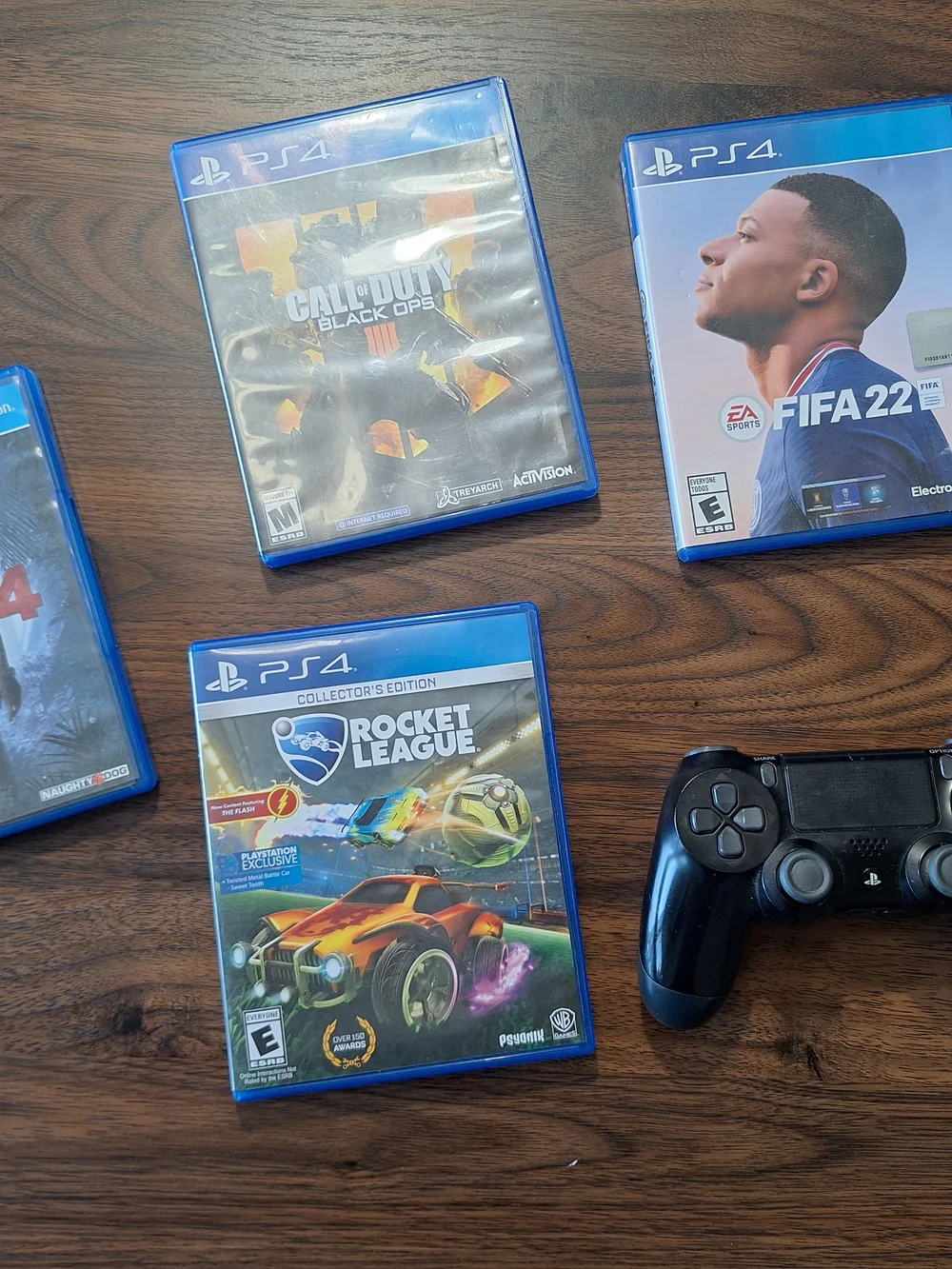 Sony PS4 Controller with Black Finish and Blue Game Cases Bundle